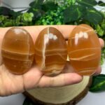 Beautiful Red Honey Calcite Palm Stone