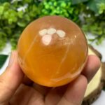 310g Beautiful Red Honey Calcite Sphere