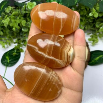 Beautiful Red Honey Calcite Palm Stone