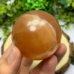 310g Beautiful Red Honey Calcite Sphere